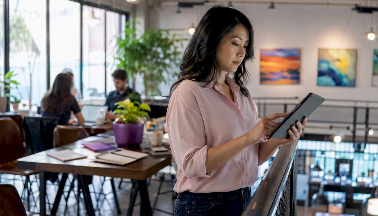 Woman using accent training tablet in office