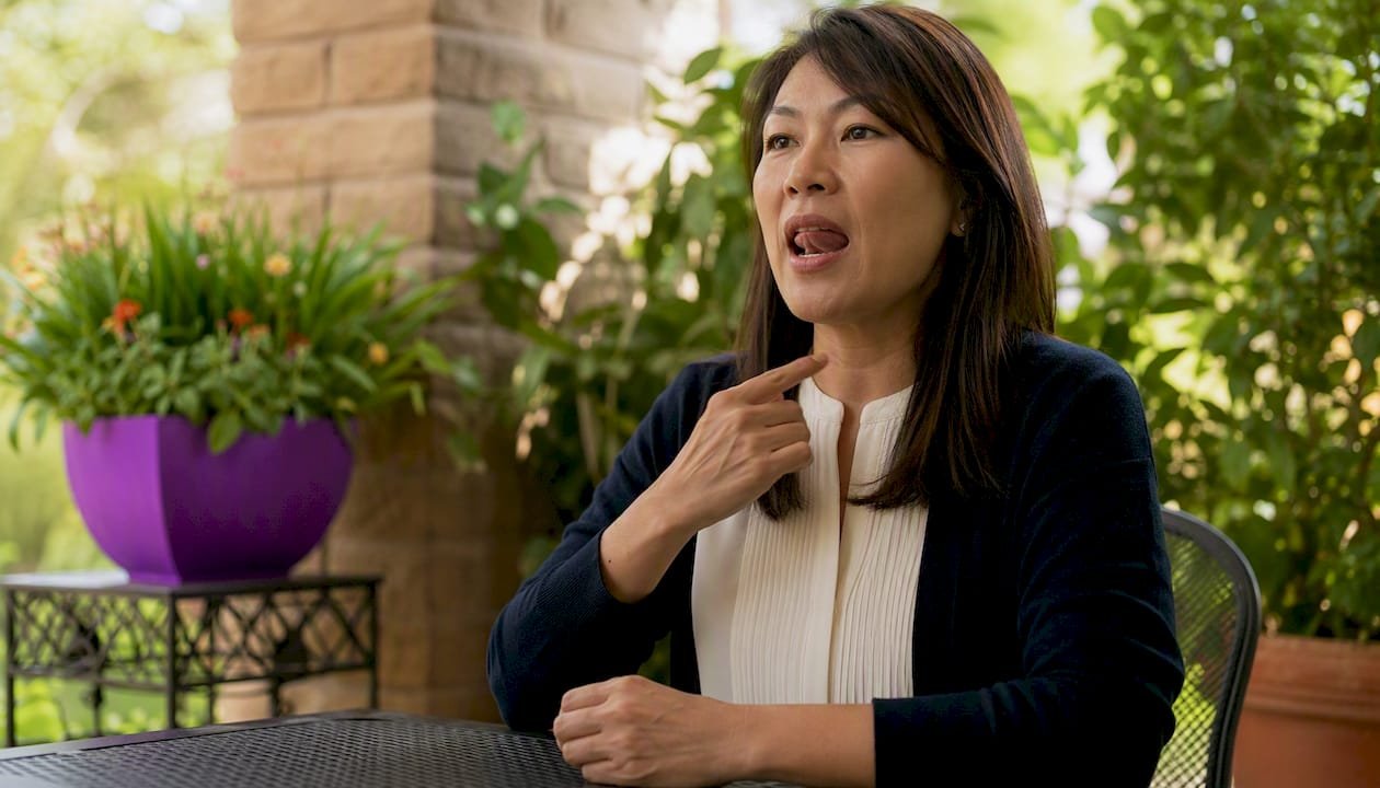 Person practicing speech warm-up exercises