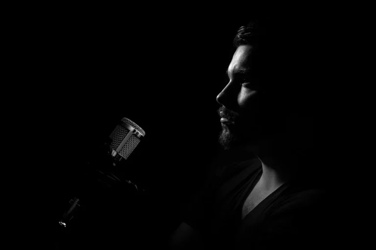 Man, microphone, profile - Fix Sentence Stress in English: Prof Alex’s 4 Errors and AI Feedback