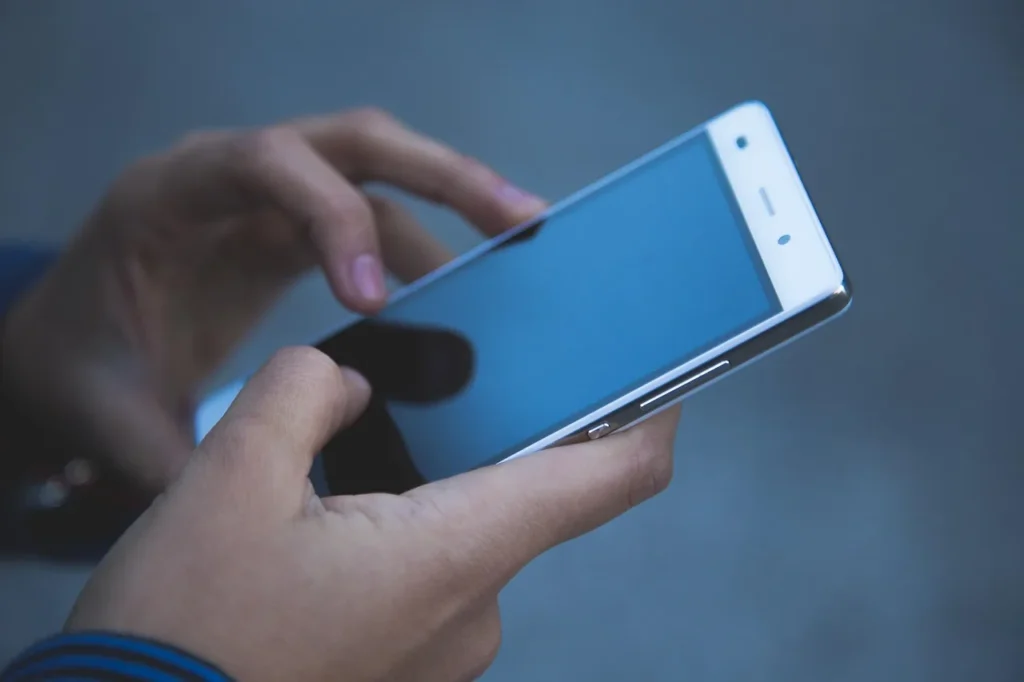 Hands, phone, smartphone - InPronunci vs BoldVoice vs ELSA Speak (2026): Which Accent Training App Should Professionals Choose?